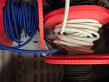 a bunch of wires and wires in a red container