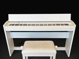 an image of a white piano with a bench in front of it
