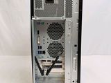 the back side of a computer case with a small fan on top of it