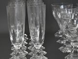 four wine glasses sitting next to each other on a table