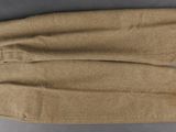 a pair of tan pants sitting on top of a table