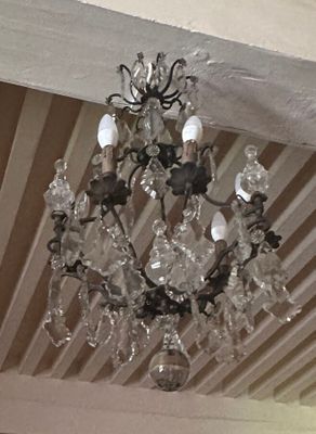 a chandelier hanging from the ceiling in a room