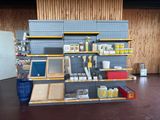 a shelf with many items on it in a room