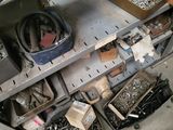 a lot of tools on a shelf in a garage