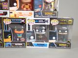 several batman pop vinyl figures are stacked on top of each other