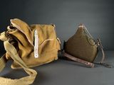 pair of brown canvas bags with leather handles on grey surface