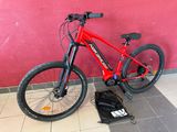 a bike that is sitting on the ground next to a wall