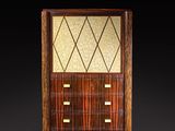 an art deco cabinet with a geometric design on the front