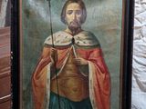 an old painting of a man with a crown on a chair