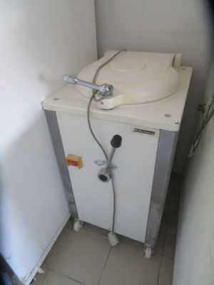 a small white sink in a small bathroom with a faucet attached to it