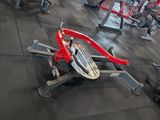 a lot of exercise machines in a gym room