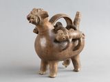 sculpture représentant un mouton portant un bébé sur son dos