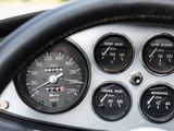a close up of a car dashboard with gauges and a steering wheel