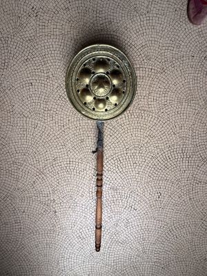 a wooden stick sticking out of a hole in the ceiling