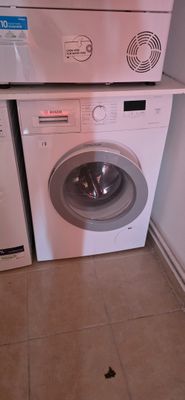 a washing machine and a dryer stacked on top of each other
