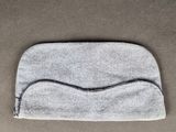 a close up of a gray bag sitting on top of a table