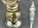 a small glass candle holder and a small glass candle holder on a table