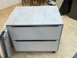 two drawers that are sitting on the floor next to each other