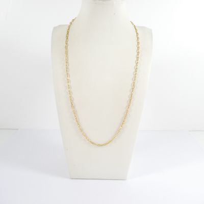 a white mannequin with a gold chain on it
