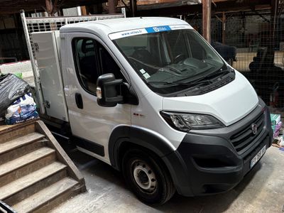 a white van that is parked in front of some stairs