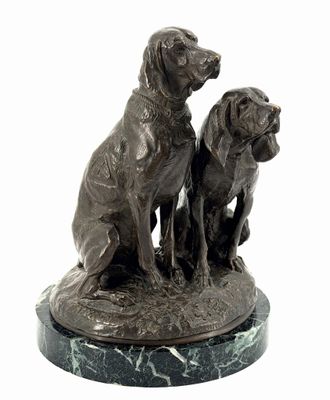 a statue of two dogs sitting on top of a marble base