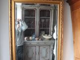 a man taking a picture of himself in the mirror