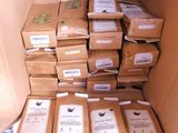 many boxes of food sitting in a box on the floor
