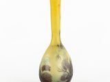 yellow and green vase with a floral design on the bottom