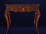 an antique wooden table with a black and gold decoration on the top