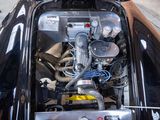 a picture of a car engine in the trunk of a car