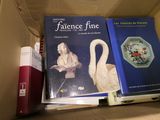 two books in a box one of which is a swan and the other of which is a vase