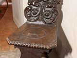 a wooden chair that is sitting on the floor