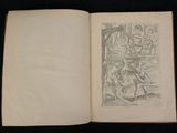 an open book with a drawing of a man on a horse