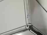 a close up of a metal object on a white surface