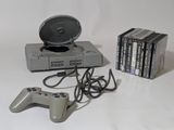 a video game system and a game controller on a table
