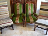 three green chairs with striped upholstered seats in a living room