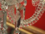 a crystal chandelier hanging from the ceiling in a room