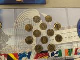 a lot of coins that are sitting on a table