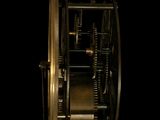 a close up of a clock on a black background