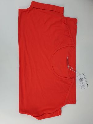 the shirt is red and has a white tag on it