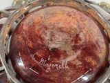 a close up of a vase on a table