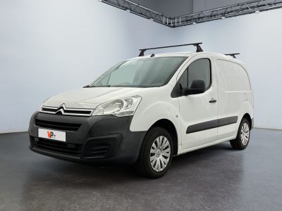 the white van is parked in a large room with a roof rack