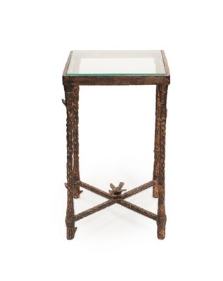 une petite table en verre avec un piètement en métal et un plateau en verre