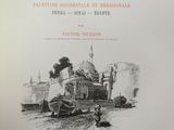 an old book with a drawing of a train on it ' s cover