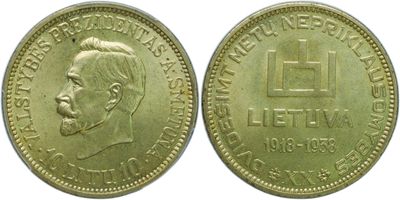 a close up of a gold coin with a man ' s face on it