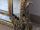 a mirror that is sitting on the floor in front of a wall