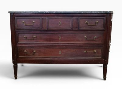 an image of a dresser with a marble top