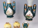 three vases that are sitting next to each other on a table