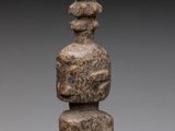 a close up of a stone sculpture on a white surface
