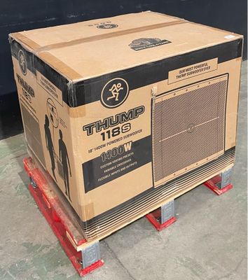 a cardboard box sitting on a pallet on the ground